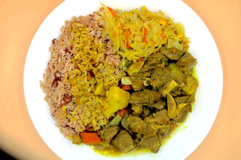 Curried goat plate seen from above