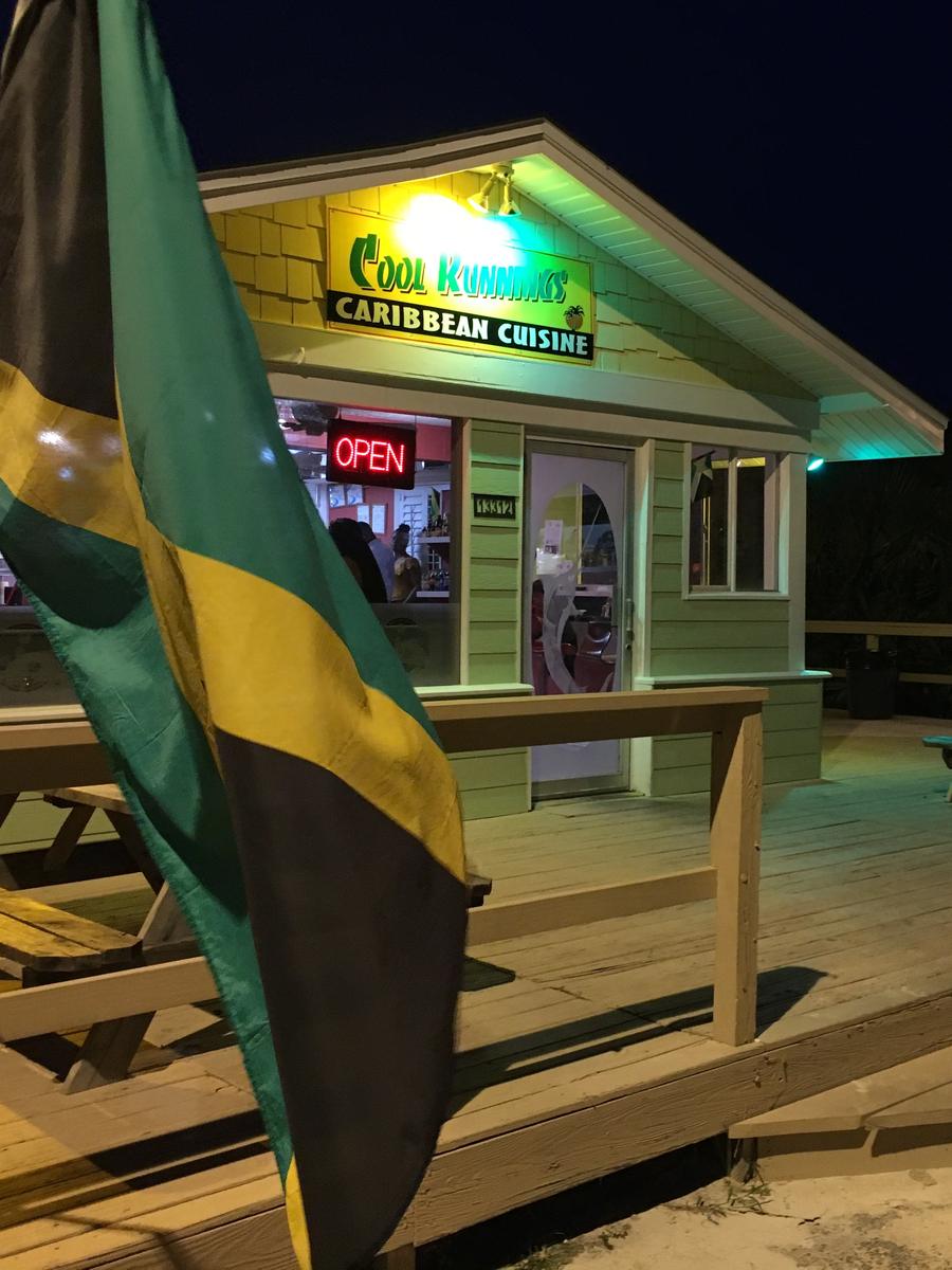 The Cool Runnings patio and front door at night